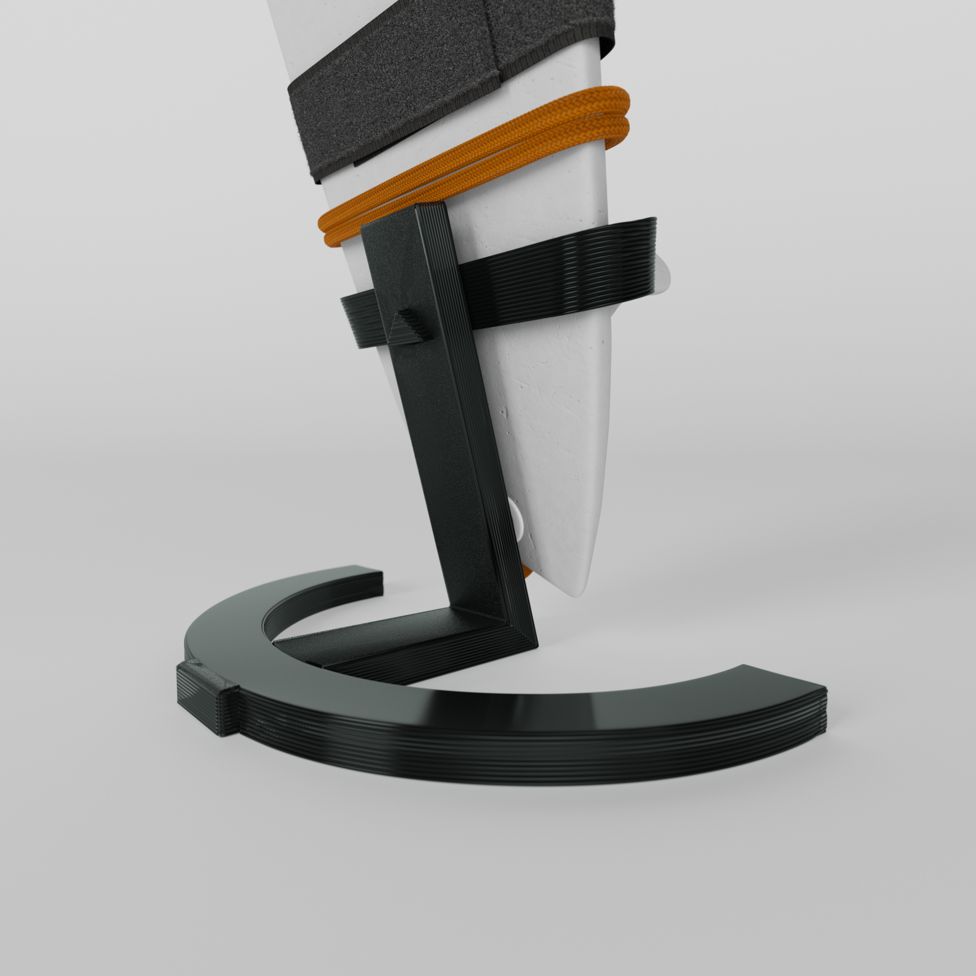 Mini foam surfboard on a black plastic stand made from recycled materials, branded Aloha Tinyboards™