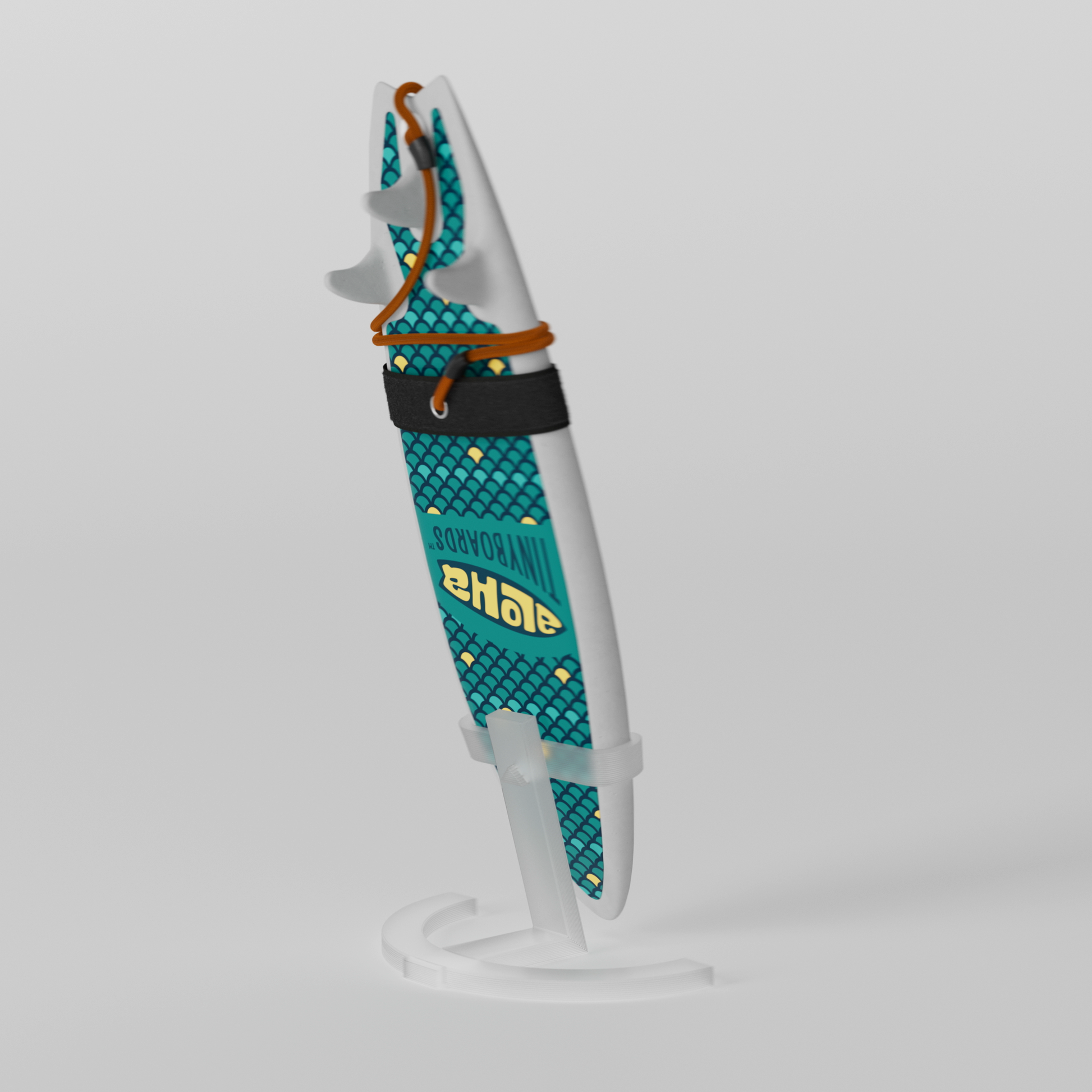 Mini foam surfboard on a clear plastic stand made from recycled materials, branded Aloha Tinyboards™