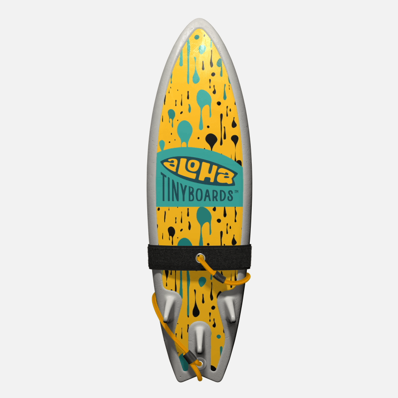 Animated GIF of Aloha Tinyboards foam finger surfboard rotating 360° showing the Dripping teal-and-black drop pattern on yellow.
