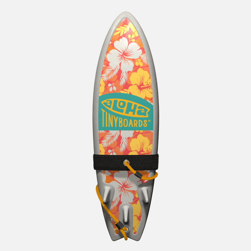 Animated GIF of Aloha Tinyboards foam finger surfboard rotating 360° showing Hawaiian Flowers coral background with white and yellow hibiscus.