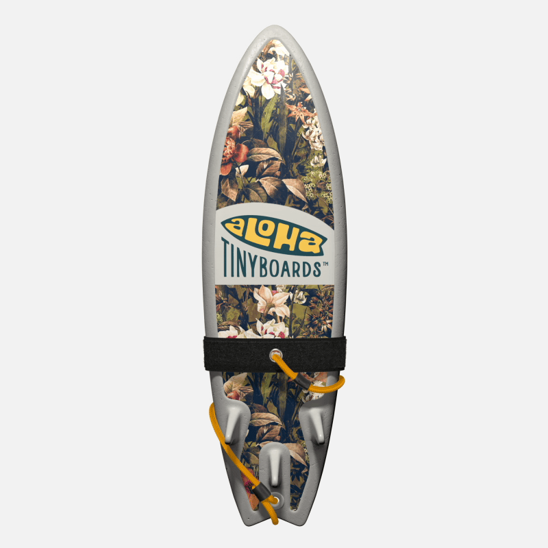 Animated GIF of Aloha Tinyboards foam finger surfboard rotating 360° showing Locals Only vintage botanical collage with white and orange florals.