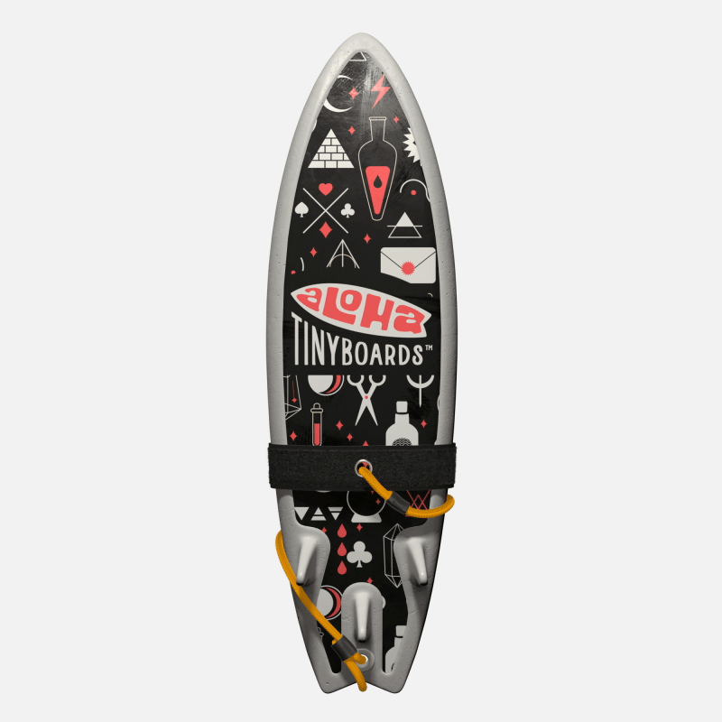 Animated GIF of Aloha Tinyboards foam finger surfboard rotating 360° showing Magic coral mystical symbols and white icons on black.
