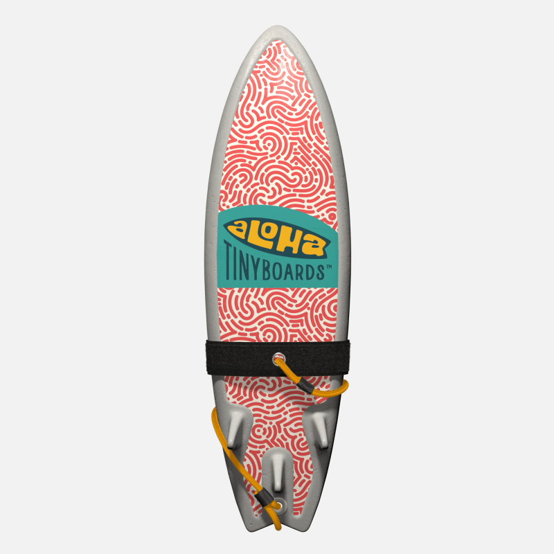 Animated GIF of Aloha Tinyboards foam finger surfboard rotating 360° showing Maze coral maze-like squiggle pattern on white.