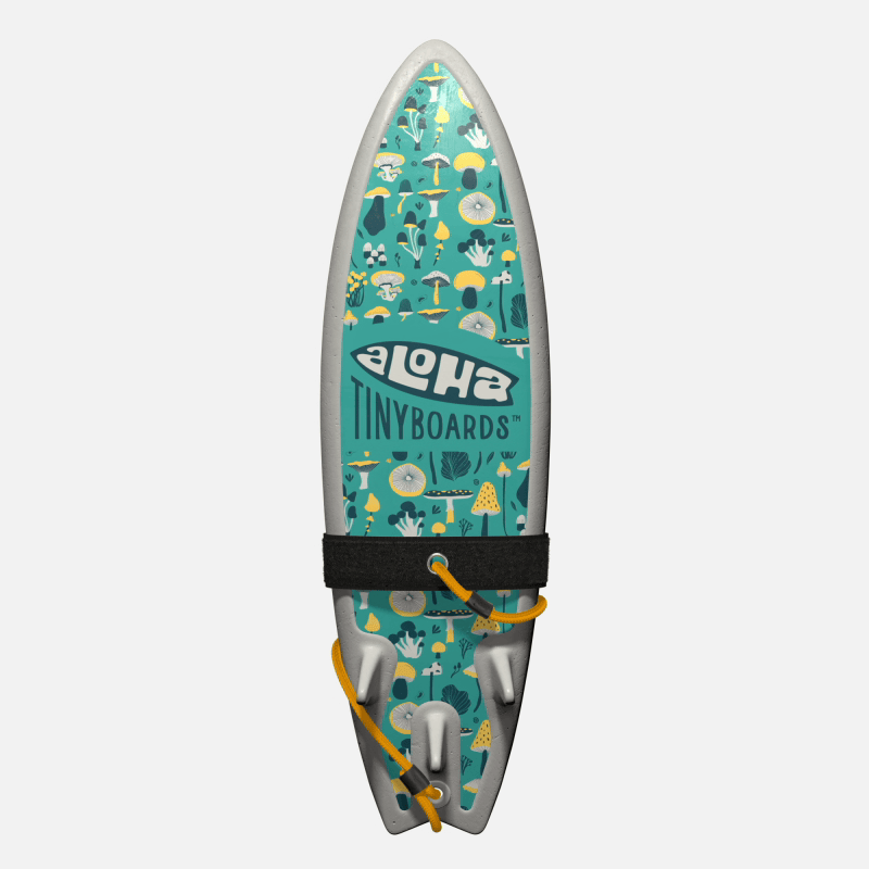 Animated GIF of Aloha Tinyboards foam finger surfboard rotating 360° showing Mushrooms assorted mushroom illustrations on teal.