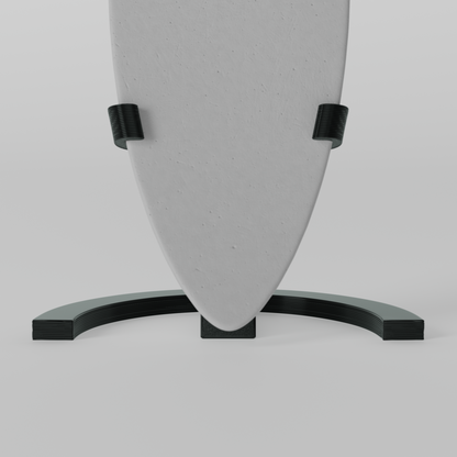 Mini foam surfboard on a black plastic stand made from recycled materials, branded Aloha Tinyboards™
