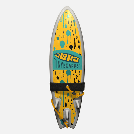 Animated GIF of Aloha Tinyboards foam finger surfboard rotating 360° showing the Dripping teal-and-black drop pattern on yellow.