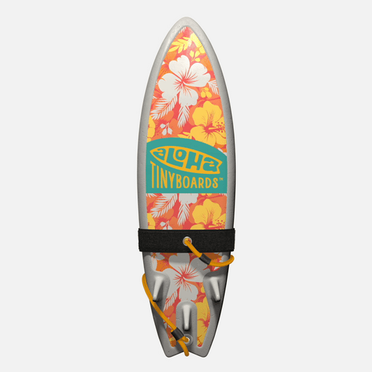 Animated GIF of Aloha Tinyboards foam finger surfboard rotating 360° showing Hawaiian Flowers coral background with white and yellow hibiscus.