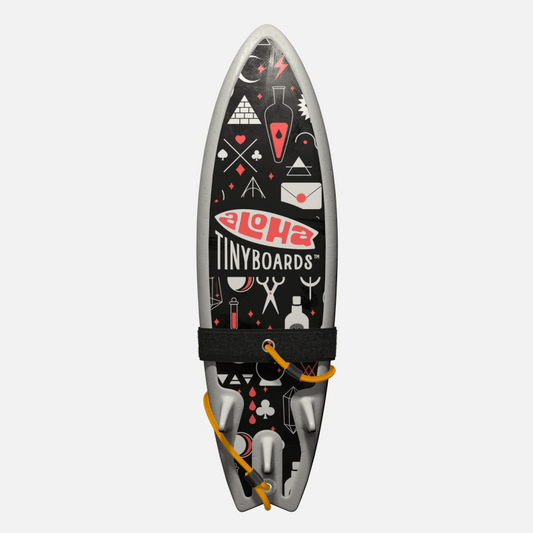 Animated GIF of Aloha Tinyboards foam finger surfboard rotating 360° showing Magic coral mystical symbols and white icons on black.