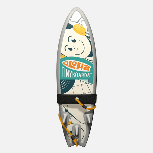 Animated GIF of Aloha Tinyboards foam finger surfboard rotating 360° showing Music playful cartoon surfer motif and geometric accents.