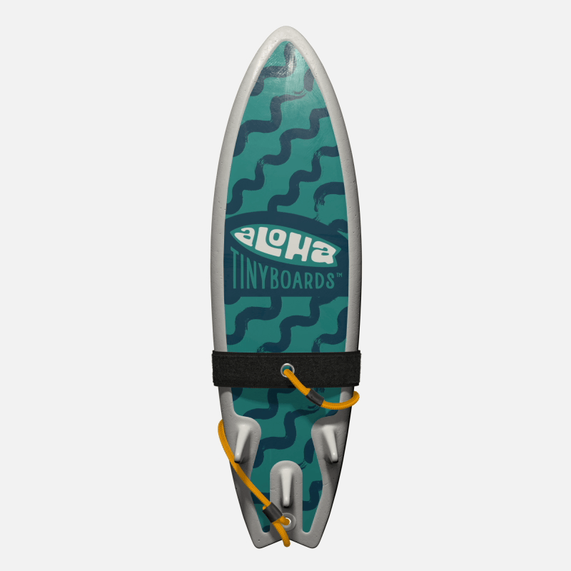 Animated GIF of Aloha Tinyboards foam finger surfboard rotating 360° showing Noodles teal brushstroke noodle shapes on teal background.