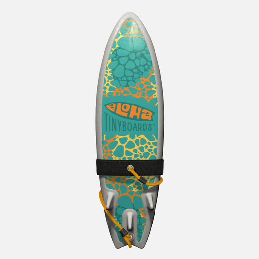 Animated GIF of Aloha Tinyboards foam finger surfboard rotating 360° showing Stones turquoise-and-coral pebble pattern on yellow.
