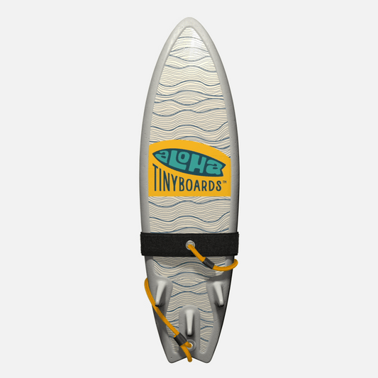 Animated GIF of Aloha Tinyboards foam finger surfboard rotating 360° showing Waves navy wavy line pattern on white.