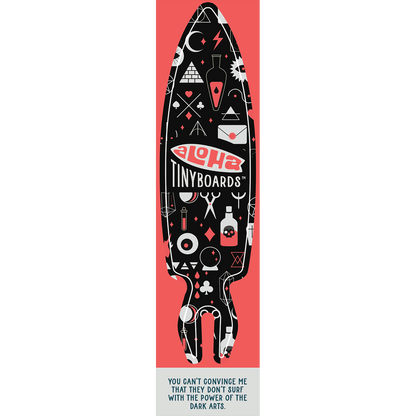 Aloha Tinyboard magic sticker decal with white and coral mystical symbols on black, created by a local surfer featuring a Story from the Lineup: You can’t convince me that they don’t surf with the power of the dark arts.